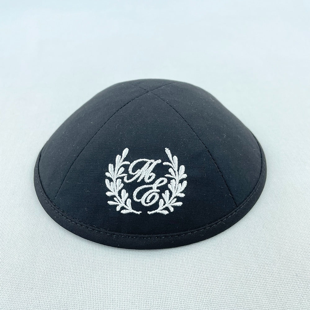 Black cotton yarmulke with white monogram embroidery